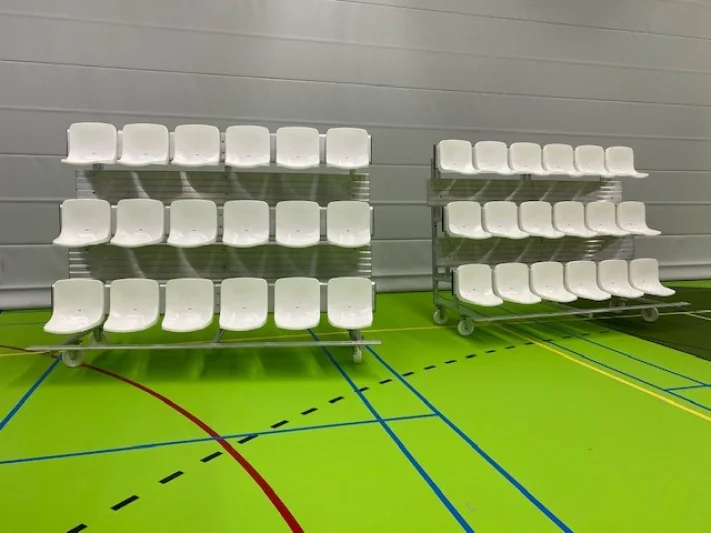Mobile and tilting grandstands for sports hall