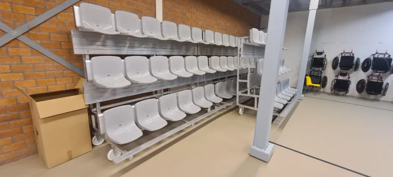 Mobile and tilting grandstands for sports hall